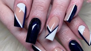 Navy blue abstract nail art on acrylic coffin nails
