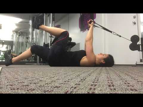 Weighted dead bug core exercise