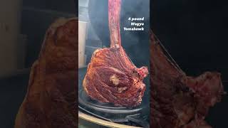 Wagyu Tomahawk steak on a grill
