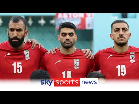 Iran players remain silent during their national anthem at the World Cup