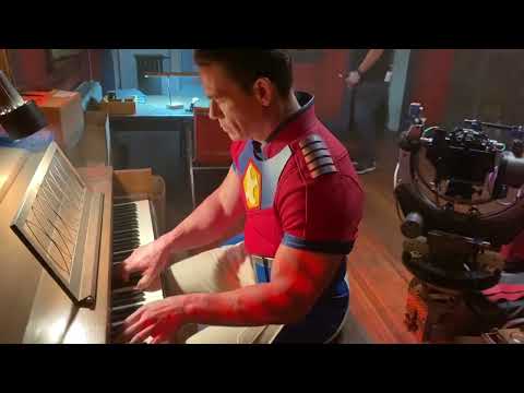 John Cena playing piano on the set of Peacemaker