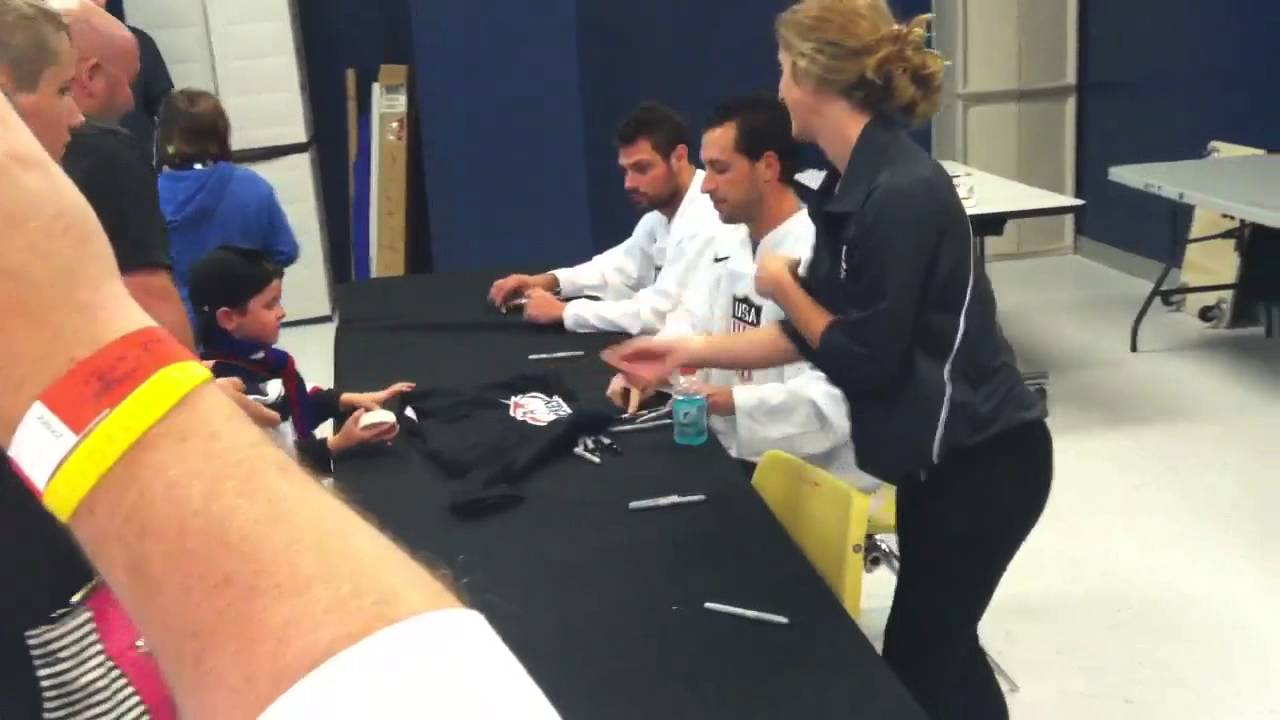 Ryan Callahan and Zach Bogosian signing autogaphs at the 2014 USA Olympic camp