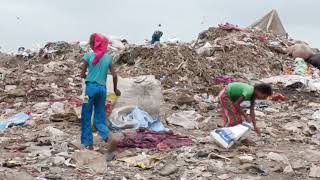 Children living and working in New Delhi landfills for $2 per day