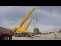 Crane lifts up 80 ton locomotive and puts it on the tracks