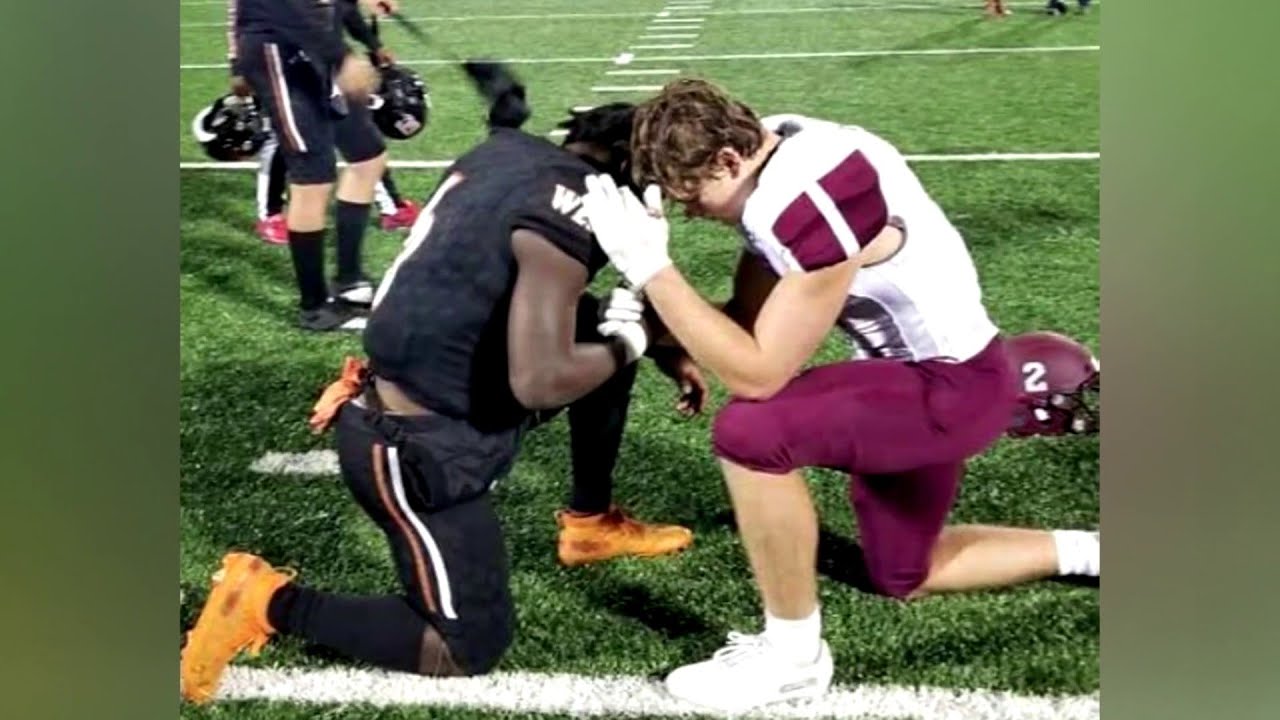Opposing High School Football Players Pray Together After Game