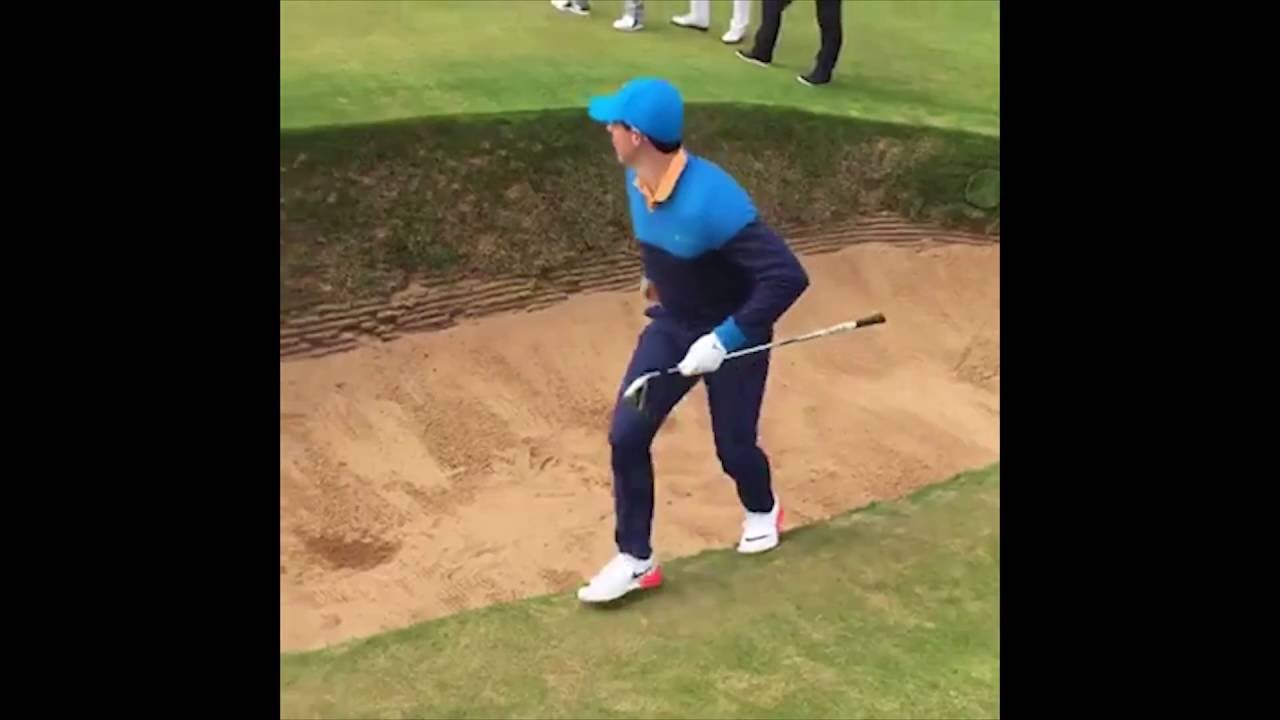 Rory McIlroy takes 6 to get out of a greenside bunker at the 
