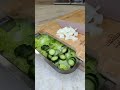 Start with a messy counter full of chopped veggies. Quickly "swipe" them into the board's containers