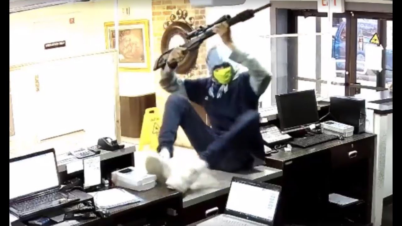 VIDEO: Man tries to rob hotel clerk at gunpoint, she pulls gun on him instead