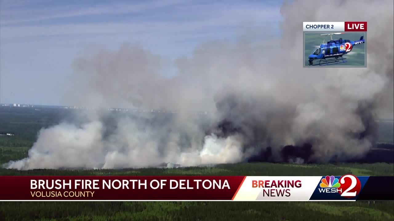 Crews battle brush fire north of Deltona - YouTube