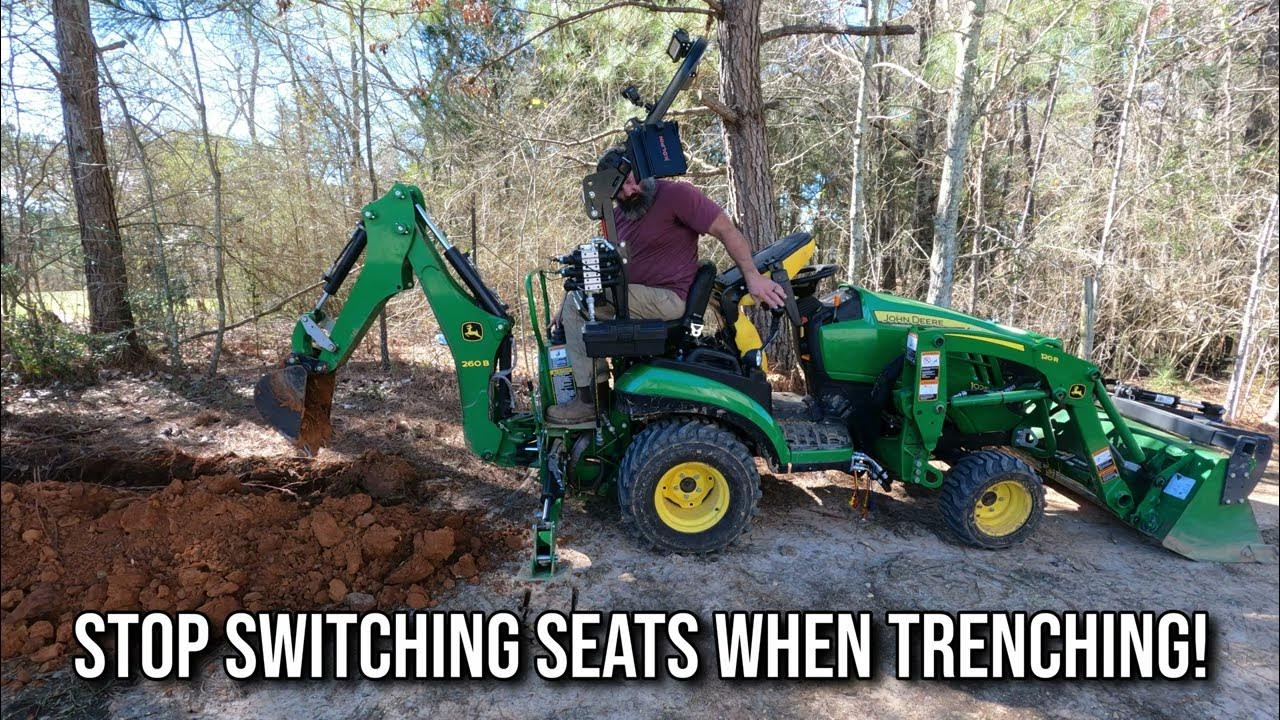 Digging a trench for water with John Deere 1025r w/ 260b backhoe YouTube