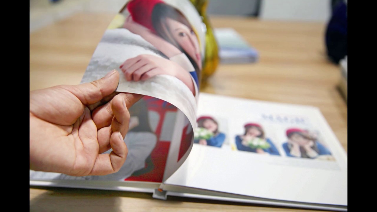 A standard wedding album cover comes to life with the best images of the day in a slide show!