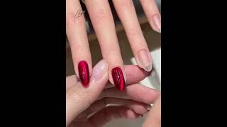 Bold red cat eye base with luminous metallic sheen, paired with sparkling silver French tip accents✨
