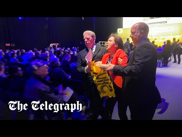 Shell protesters rush stage as hijacked AGM descends into chaos class=