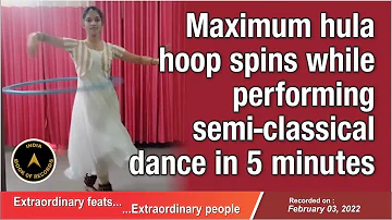 Maximum hula hoop spins while performing semi-classical dance in 5 minutes