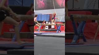 Aria Working Her Back Walkover On Beam