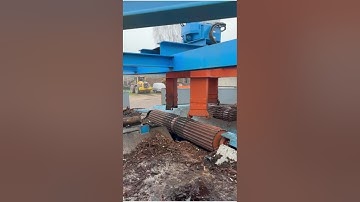 Log feeding line in a sawmill, with log turner and debarker CAMBIO 45.