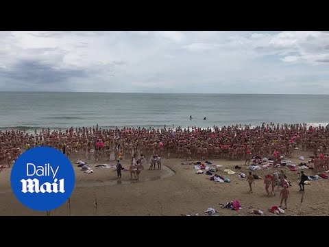 Hundreds of women strip off for charity