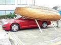 Boat climbs to car top by single hand