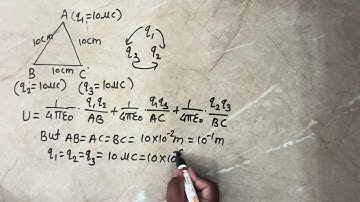 14. Three particles, each having a charge of 10μC are placed at the corners of an equilateral triang