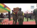 Ghana Immigration Service officers carry remains of late Dr. John Kumah to the hearse for burial