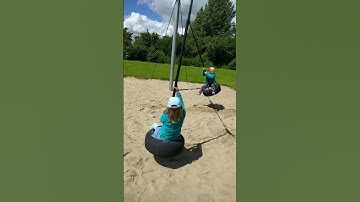 Coupled-pendulum experiment with real swings