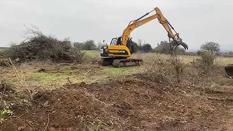jcb js 130 grab clearing ground