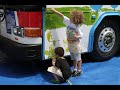 Child artists paint mural on metrobus during belleville il art on the square