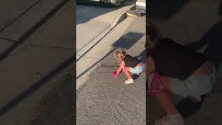 Girl rides skateboard down driveway then faceplants on pavement