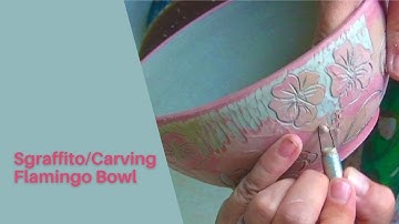 Multi colored sgraffito process on a pottery bowl.