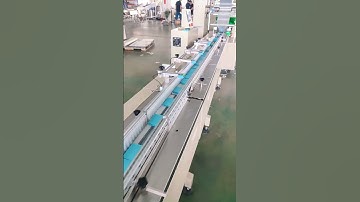 This is a fully automatic feeding counting bag cutting horizontal multifunctional packaging line