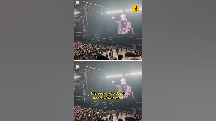 Liam Gallagher speaks to fans on stage as Oasis reunite