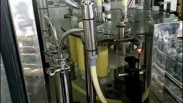 Máy chiết rót đóng nắp chai sữa bắp tự động