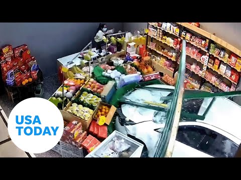 Car crashes into fruit shop in China, employee barely escapes | USA TODAY