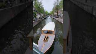 BOATS IN CANALS OF AMSTERDAM