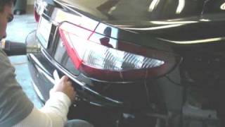 Tinted smoked tail light film cover installation on maserati