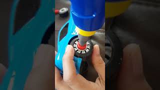 Attaching toy car wheels with electric toy drill