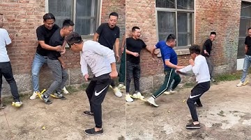 The Screaming Chicken blindfolds and beats people challenge again men