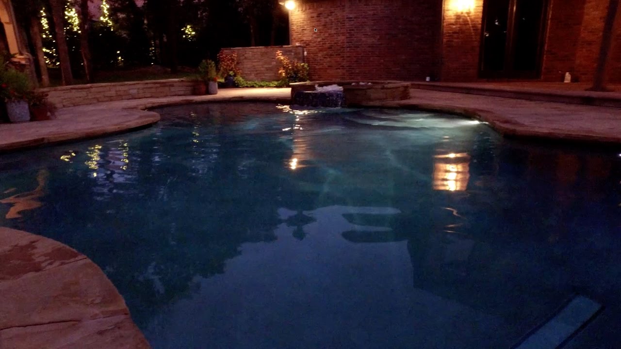 Elegant custom pool & hot tub, set perfectly under towering trees.  Aquascape Pools OKC