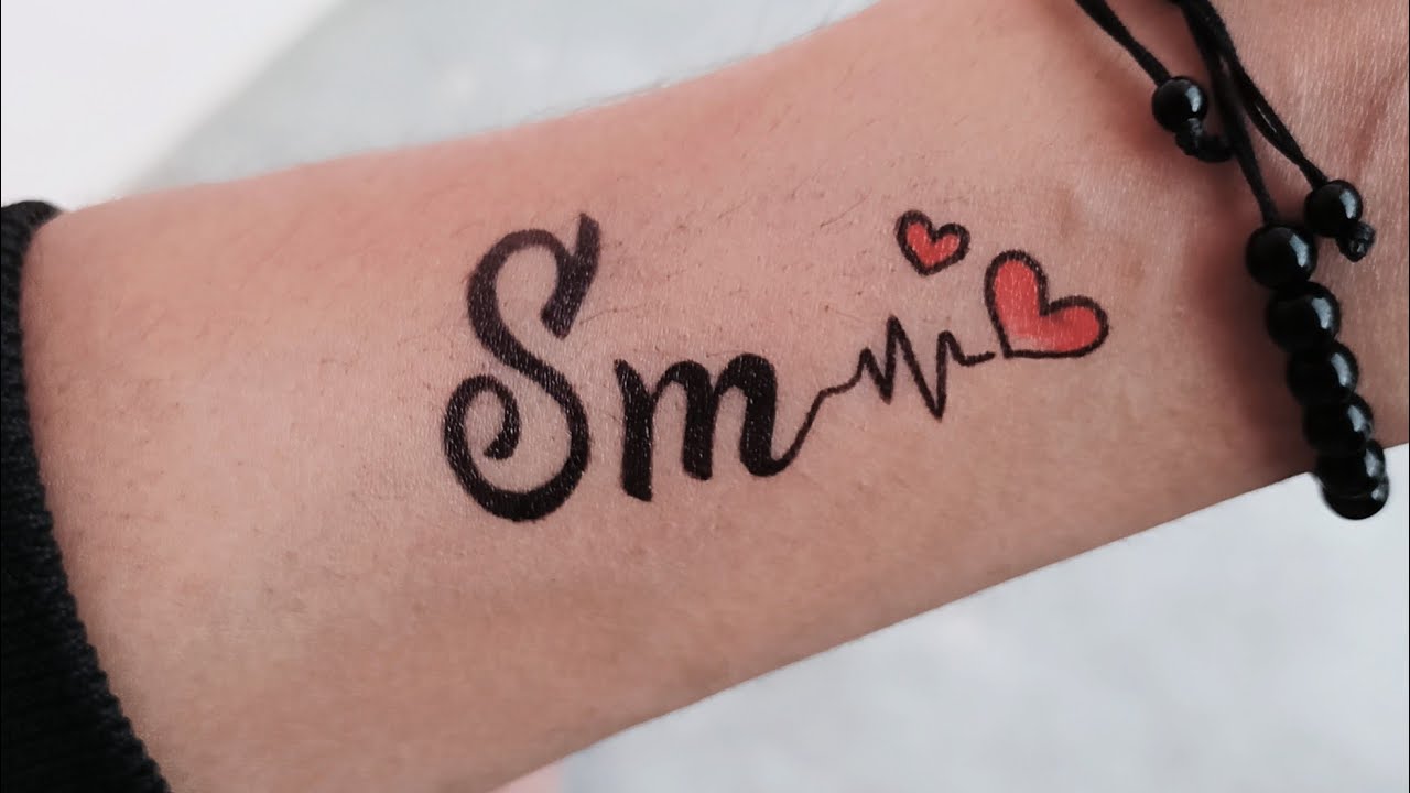 temporary SM couple letter tattoo making on hand | SM name tattoo ...