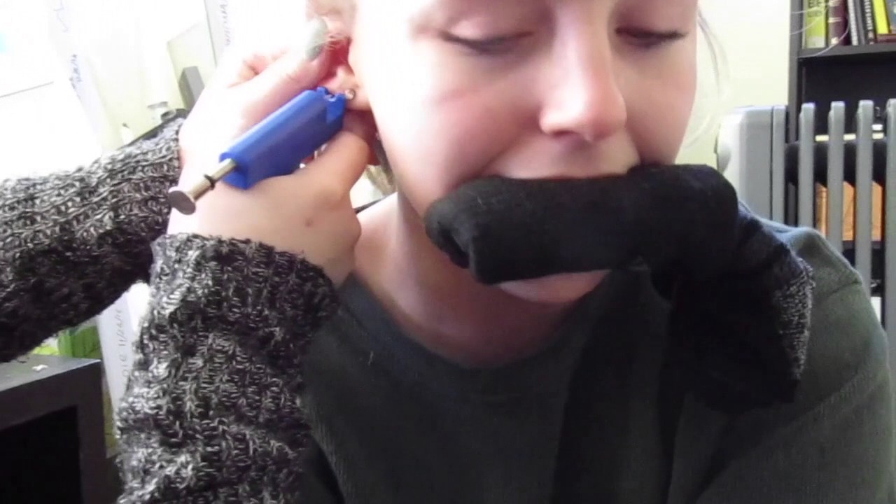 THE PIERCING GUN GOT STUCK IN HER EAR!!! YouTube