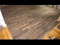 Wood look plank tile installation time lapse on Schluter Ditra with T-Lock™