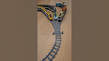 Triple switch release — three LEGO trains merge into one track