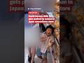 A child gets pushed by a woman in a Japan convenience store