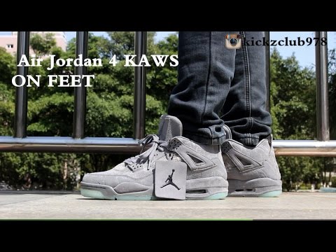 jordan 4 kaws grey on feet
