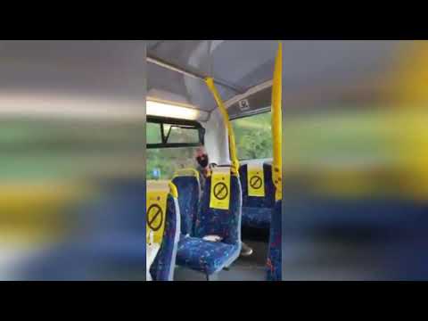 Shocking video shows self-professed "racist" hurling abuse at passengers on bus