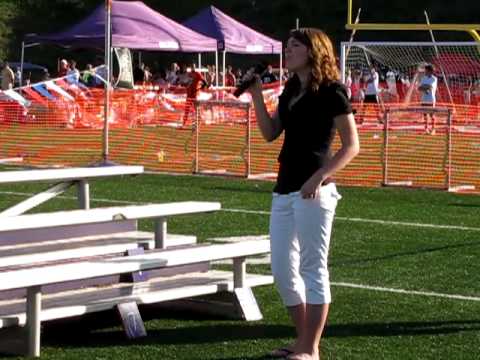 Courtney Handlovitch singing the National Anthem a...