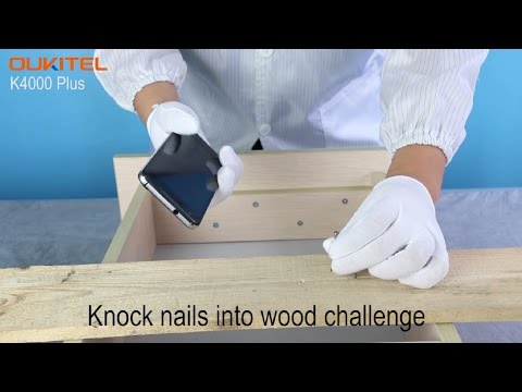 OUKITEL K4000 Plus meets screen challenge-crack walnuts, knife scratch and knock nails into wood