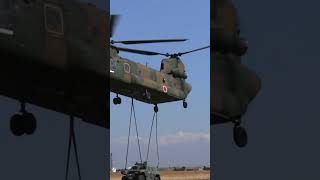 Helicopter unloads Jeep