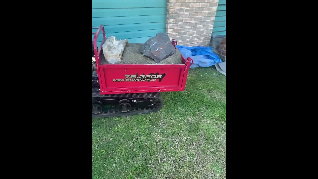 Mini dumper moving soil and rocks