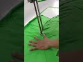 cutting a pile of fabric using a special cutting tool to cut it neatly#automobile